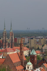 Fototapeta premium Warm, spring day in Wroclaw. View from the tower of the church of St. Elisabeth to the old town, churches, buildings, tenement houses, office blocks, blocks of flats. Breslau, Wrocław, Poland, Polen