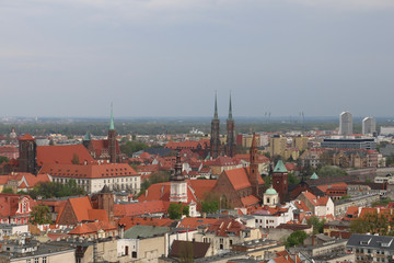 Warm, spring day in Wroclaw. View from the tower of the church of Saint Elizabeth to the Cathedral, Ostrów Tumski, old town, churches, Odra River, blocks of flats, the Olympic Stadium, dormitories