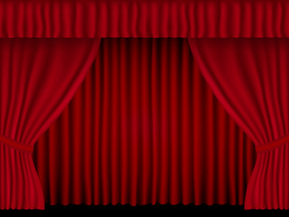 Beautiful red theatre folded curtain drapes on black background.