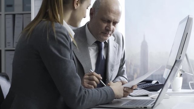 Business executives working together in the office