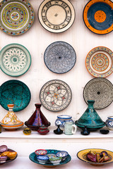 Colorful dish and tajine souvenirs for sale in a shop in Essaouira, Morocco