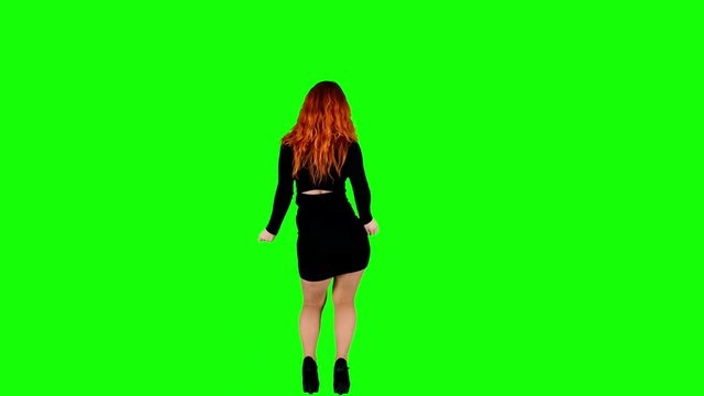 Female in Tight Dress Shakes her Booty and Looks at the Camera on Green Screen