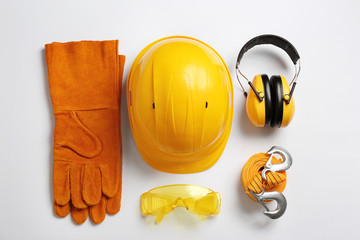 Flat lay composition with safety equipment on white background - Powered by Adobe