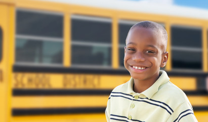 Young African American Boy Near School Bus - obrazy, fototapety, plakaty