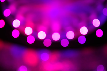 Purple and pink abstract bokeh background.