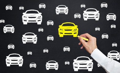 hand drawing car icon. Man point yellow car icon with chalk on blackboard
