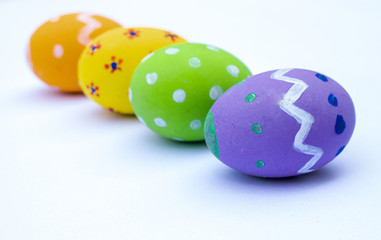 Happy Easter. Easter eggs concept. Row Easter eggs on white background and copy space for advertisers.