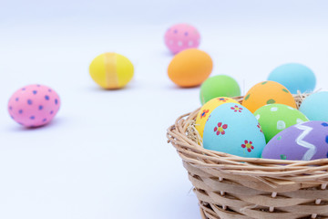 Fototapeta na wymiar Happy Easter. Easter eggs concept. The colorful of Easter eggs on white wooden background.