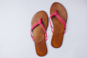 Leather flip-flop shoes, isolated on white.