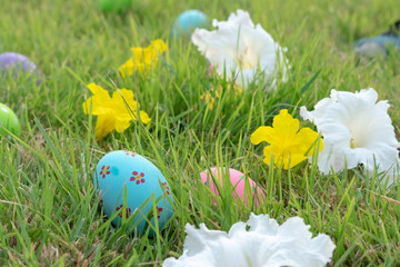 Happy Easter Day. Easter eggs concept. The colorful of Easter eggs in nest on grass green background.