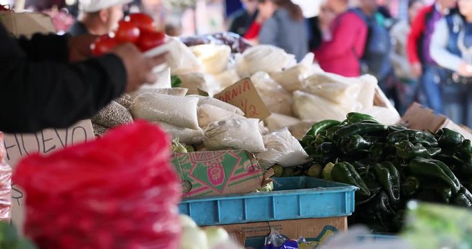 Ciudad Juarez Mexico vegetable market. Population of 1.5 million people. Paso del Norte Bridge border crossing. El Paso Texas fence wall on USA side to control immigration. Dangerous city.