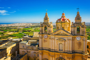 Aerial view of church in Mdina city - old capital of Malta. Greeny Winter Malta island. Morning...