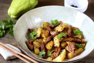 chayote with beef and sesame in asian style. The dish is popular in Asia, especially in Vietnam. recipe with chayote.