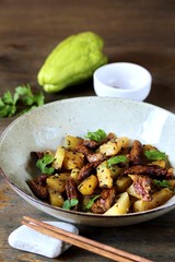 chayote with beef and sesame in asian style. The dish is popular in Asia, especially in Vietnam. recipe with chayote.