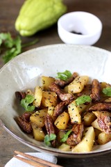 chayote with beef and sesame in asian style. The dish is popular in Asia, especially in Vietnam. recipe with chayote.