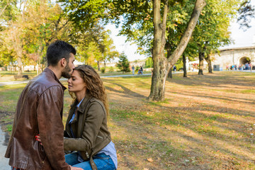 Young man kissing her girlfriends forehead