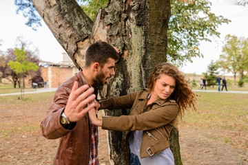 Young couple showing anger in the public park
