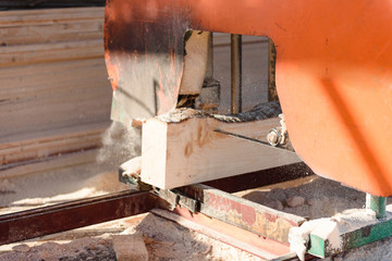 Machine for cutting wood on the boards. Sawmill. production of boards. Wood processing factory.