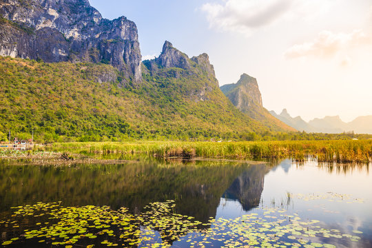 Beautiful landscape of mountain with grass field and blue sky range background in Khao Sam Roi Yot National Park, Kui Buri District, Prachuap Khiri Khan, Thailand
