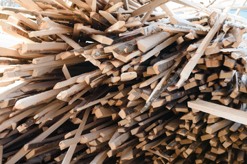 Background waste lumber. Boards are. Waste lumber closeup.