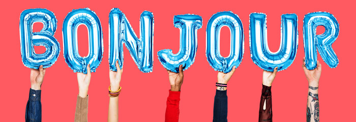 Hands holding bonjour word in balloon letters © Rawpixel.com