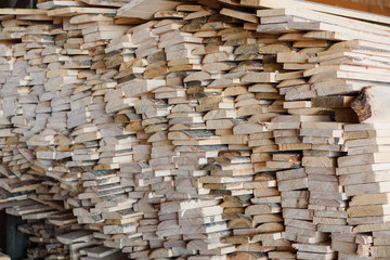 Timber at work. Lumber stockpiled. The boards are stacked. Boards for sale in stock.