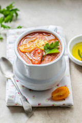 Freshly cooked tomato soup seasoned with parsley leaf