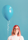 Pink haired girl with a balloon