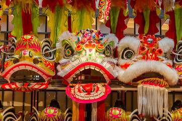 Traditional chinese lion dance head display on the shelves. 