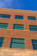 Brick building exterior with blue sky background