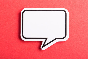 Speech Bubble Isolated On Red Background