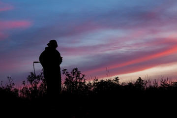 Unrecognized people using a celular smartphone in a mountain landscape