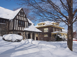 snow covered houses on a sunny day after a big storm