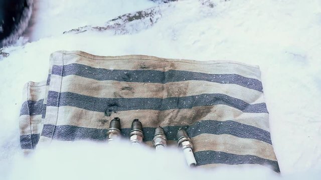 Stop motion - The car will not start, it's cold outside. Spark plugs and ignition coils, broken car parts