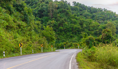 Curve road signs on down hill. Many warning sign indicating for safety