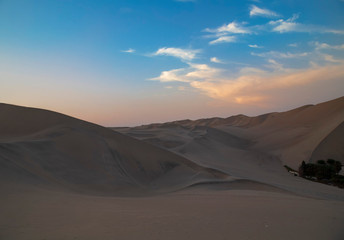 Fototapeta na wymiar Desert during sunset at Huacachina Oasis in Ica, Peru.