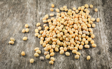 soybeans or soya beans grain seed on rustic wood background