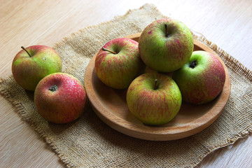 fresh apple on wooden bowl served on the table