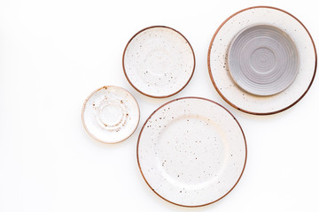 Ceramic plates pattern on white background top view space for text