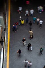 Mockup model style urban landscape - people on subway train platform - real tilt-shift TS lens