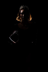Portrait Silhouette Shadow Back Rim Light of Miss Pageant Beauty Queen Contest Silver Diamond Crown wave hand express feeling smile, studio lighting dark black background, turn front face to camera © Jade