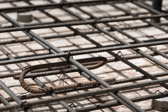 Using steel wire for securing steel bars with wire rod for reinforcement of concrete slab or focus to steel wire.