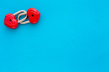 Love concept. Valentine's day symbol. Locks in shape of heart on blue background top view space for text