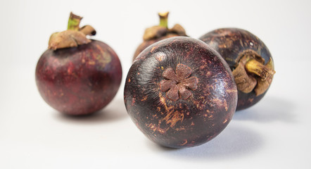 ripe mangosteen on white background