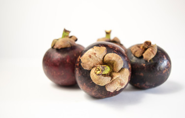 ripe mangosteen on white background