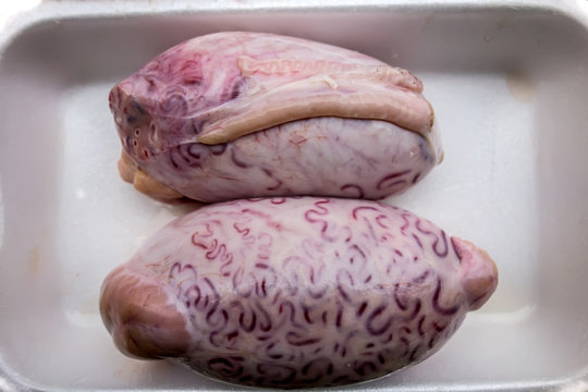 Bull testicles on a white plastic tray