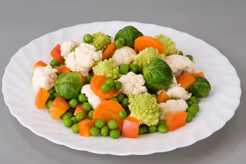 Salad of vegetables on a beautiful white plate