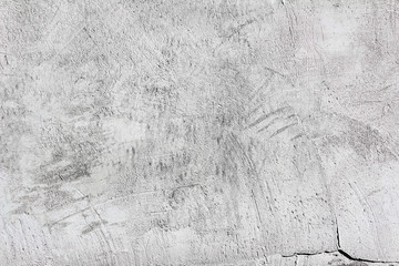 white and gray dissimilar textured plaster on the wall