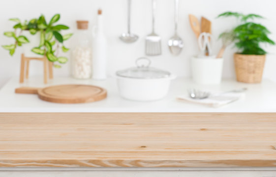 Wooden table top on blurred kitchen counter background