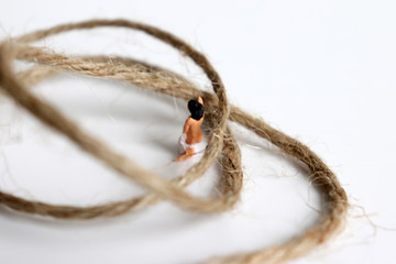 Miniature woman. The concept of sexual violence.